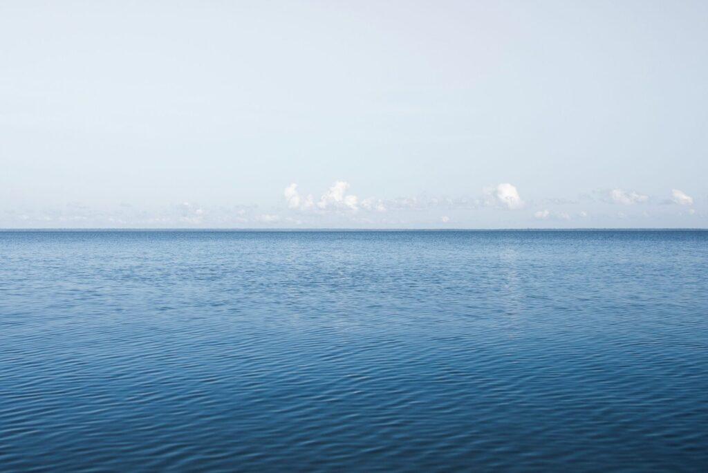 blue sea under blue sky during daytime